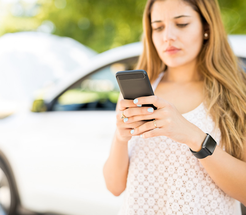 Woman calling for roadside assistance in Denton, Texas