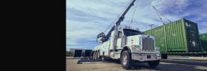 Container Moving Service Dallas Texas Heavy Duty All American Towing Wrecker Lifting Container in DFW
