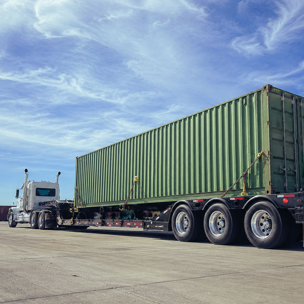 Landoll Trailer Transporting shipping container in DFW